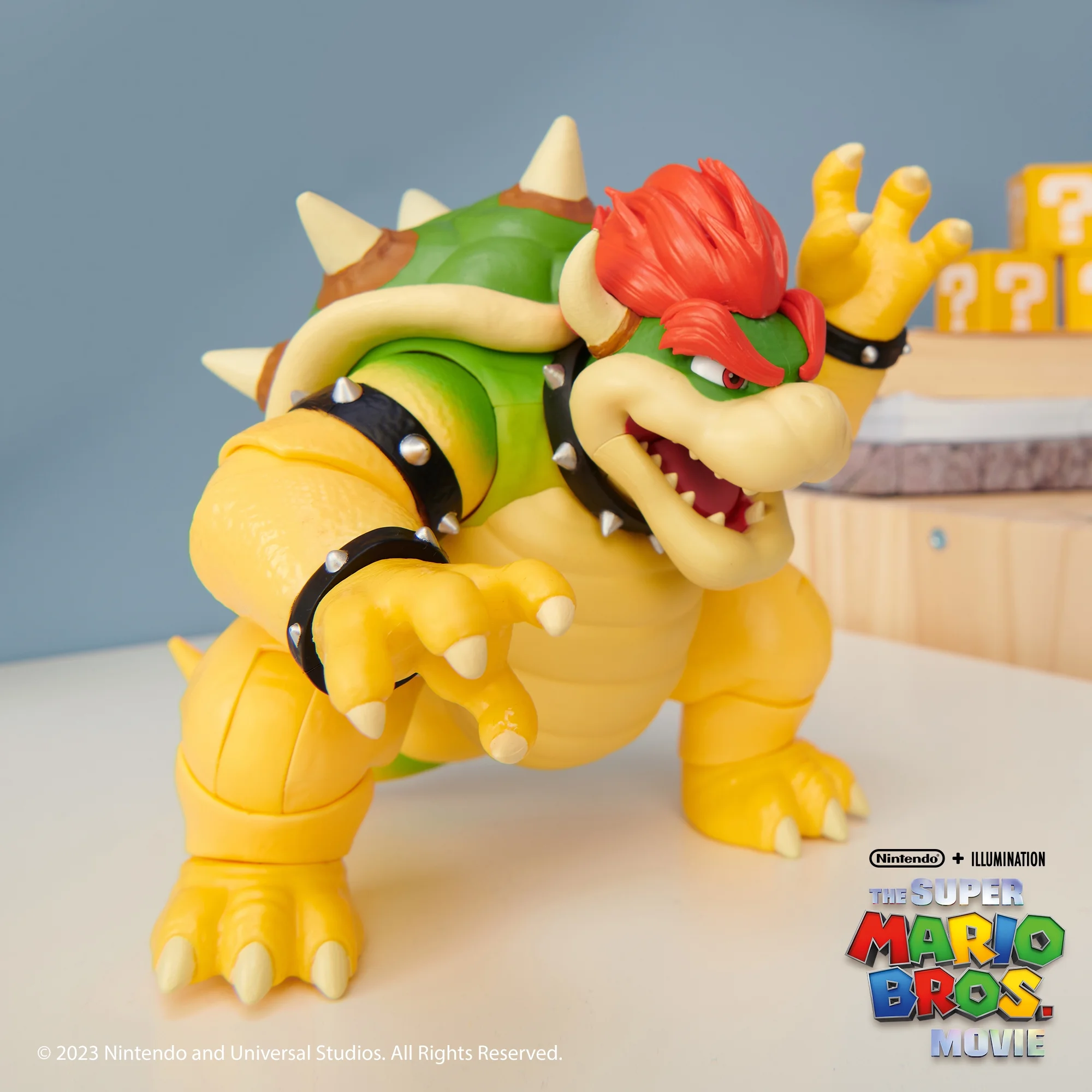 the super mario bros. movie 7 inch feature bowser action figure with fire breathing effects